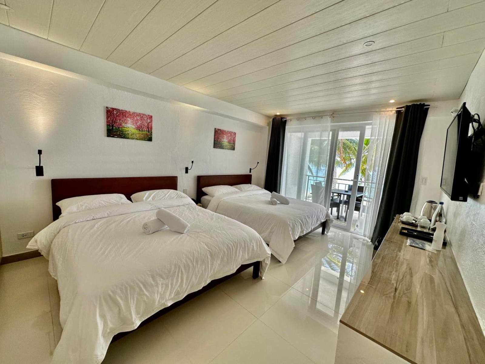 Calypso Beach And Dive Resort Manoc-Manoc Exterior foto